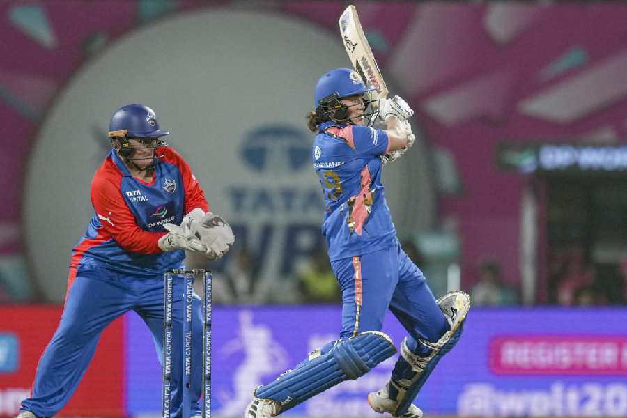 Mumbai Indians' Nat Sciver-Brunt plays a shot during a Women's Premier League (WPL) T20 cricket match between Mumbai Indians and Delhi Capitals, at the DY Patil Stadium