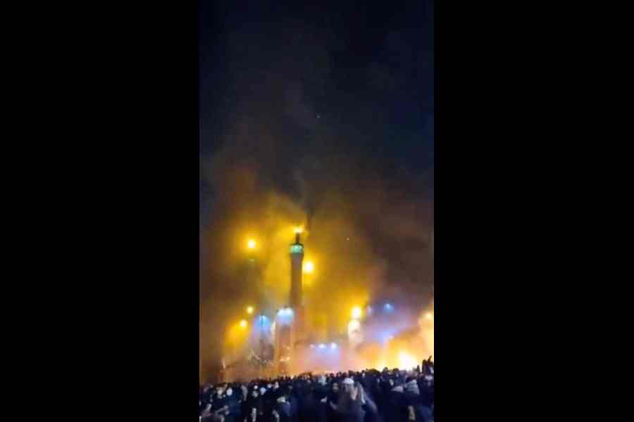 Smoke rises from a mosque amid the anti-government unrest in Tehran on Friday. 