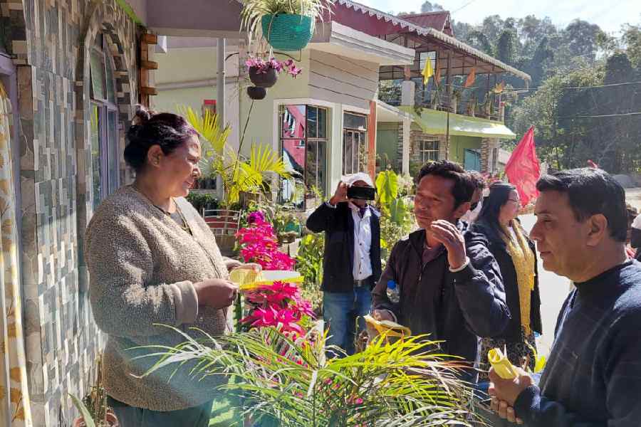 CPM members speak to a Mirik resident on Saturday as a part of the party's Adhikar Raksha Abhiyan