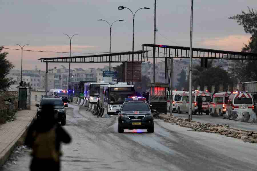 Buses, carrying Syrian Democratic Forces (SDF) members who surrendered, leave Sheikh Maksoud neighbourhood following the collapse of an agreement between the Syrian government and the SDF, in Aleppo, Syria, January 10, 2026.