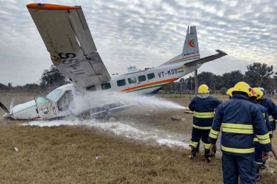 Firefighters douse a fire at the site of the crash in Raghunathpali area, Rourkela, Odisha, on Saturday. 