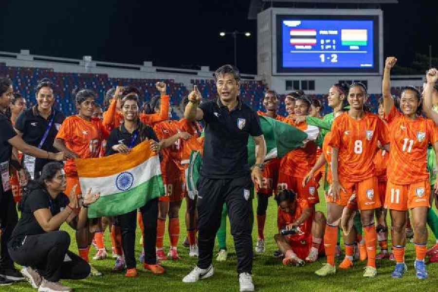 India women's team coach Crispin Chettri celebrates with the players after defeating Thailand in an Asian Cup qualifying match at Chiang Mai on July 6, last year. India earned a berth for the 2026 AFC Women's Asian Cup to be held in Australia from March 1. 