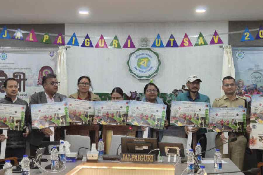 Administrative officials and others unveil the posters of Jalpaiguri Utsav at district magistrate Shama Parveen’s office in Jalpaiguri on Saturday. Picture by Biplab Basak