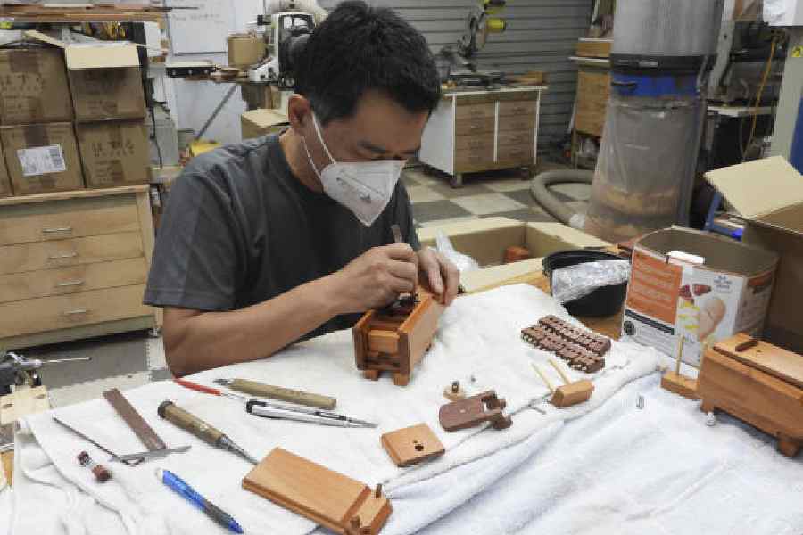 Junichi Yananose at work on a puzzle he called Hugo the Hippo at his workshop in Queensland, Australianytns/yukari nizawa