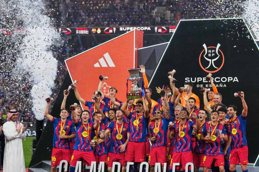 Barcelona players celebrate after winning the Spanish Super Cup final soccer match against Real Madrid at King Abdullah Sports City Stadium in Jeddah, Saudi Arabia, Sunday, Jan. 11, 2026.
