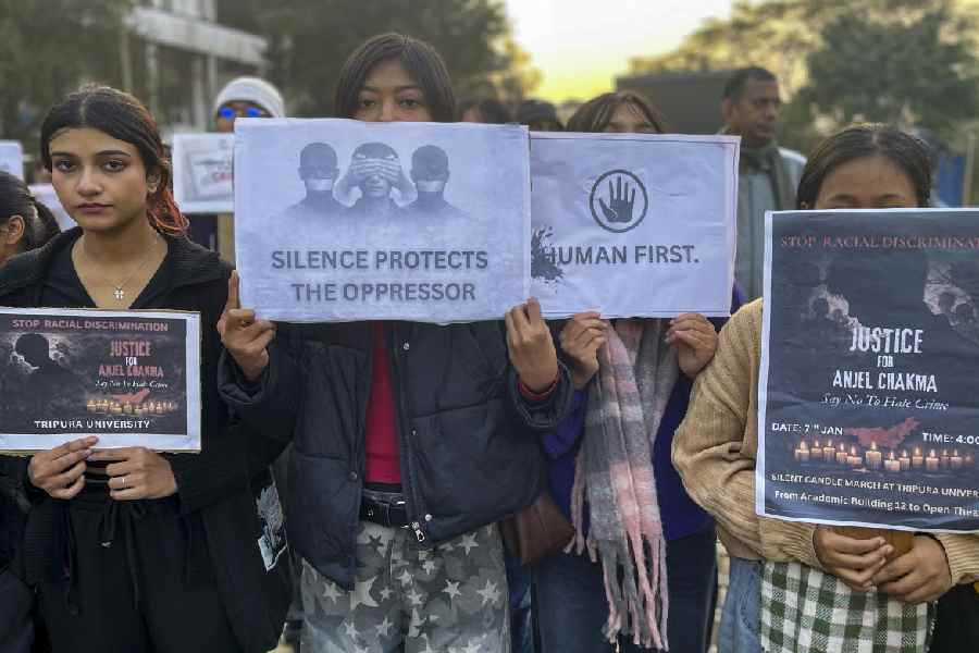 Tripura University students hold placards during a protest inside the campus demanding justice for Anjel Chakma, in Agartala, Wednesday, Jan. 7, 2026.