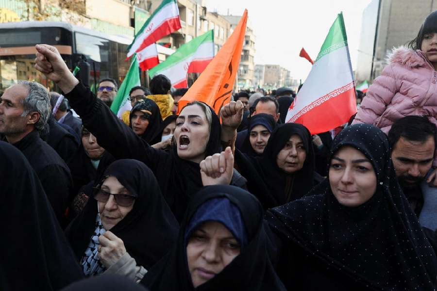Iranians attend a pro-government rally in Tehran, Iran