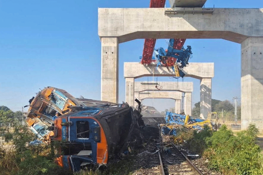 A train traveling from Bangkok to Ubon Ratchathani lies damaged after being derailed when a construction crane fell onto one of its carriages, causing multiple casualties, in Sikhio district, Nakhon Ratchasima province, Thailand, January 14, 2026.