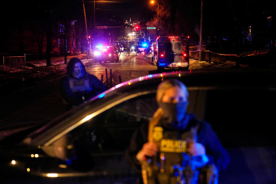 Federal immigration officers at the scene of a reported shooting Wednesday, Jan. 14, 2026, in Minneapolis.