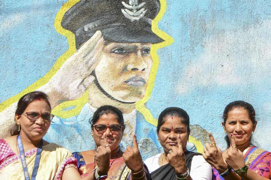 Voters show their ink-marked fingers after casting their votes at a polling station during the Brihanmumbai Municipal Corporation elections in Mumbai, Maharashtra, Thursday, Jan. 15, 2026.