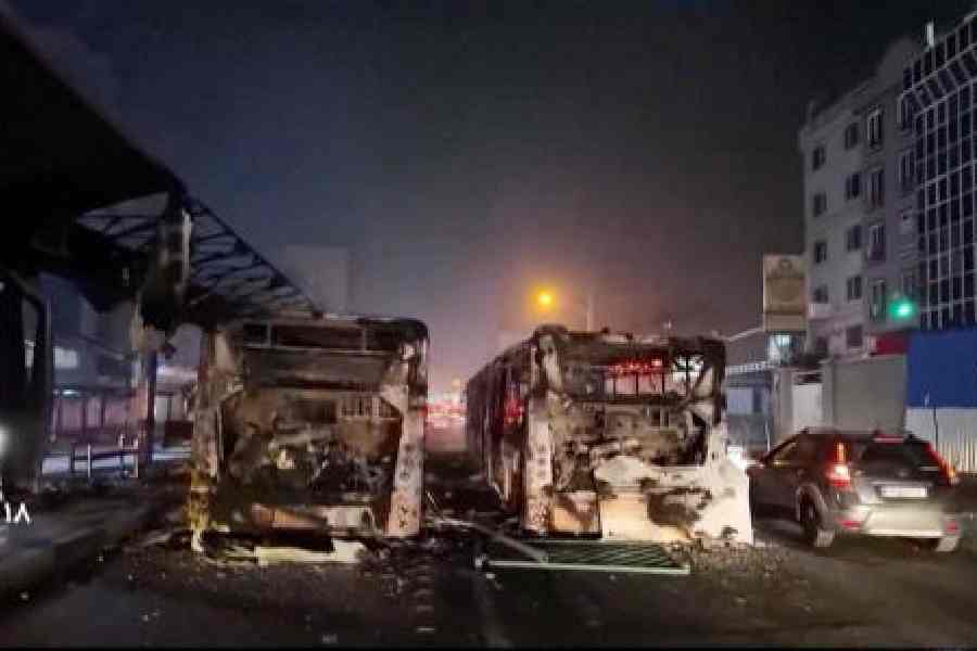 Burnt vehicles lie on the road following the unrest in Tehran on January 10. 