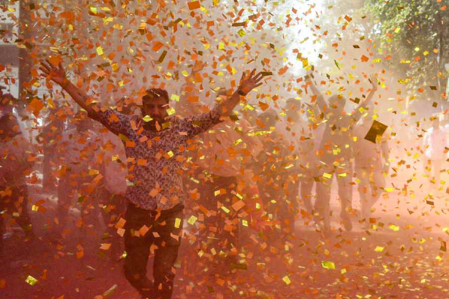 BJP workers celebrate a party candidate’s victory amid confetti and gulal in the Navi Mumbai Municipal Corporation elections on Friday.