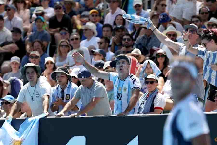 Fans of Argentina's Tomas Martin Etcheverry react during his first round match against Serbia's Miomir Kecmanovic.