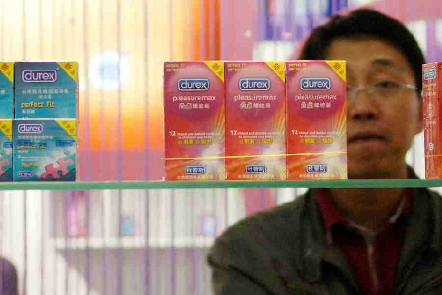 A Chinese visitor looks at condoms at the Beijing International Sex Supplies Exhibition.