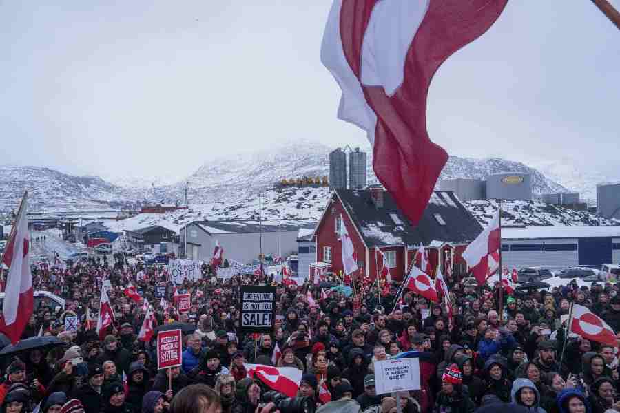 People protest against Trump's policy towards Greenland in front of the US consulate in Nuuk, Greenland, Saturday, Jan. 17, 2026.