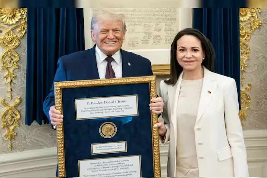 Venezuelan leader María Corina Machado presenting US President Donald Trump with her Nobel Peace Prize