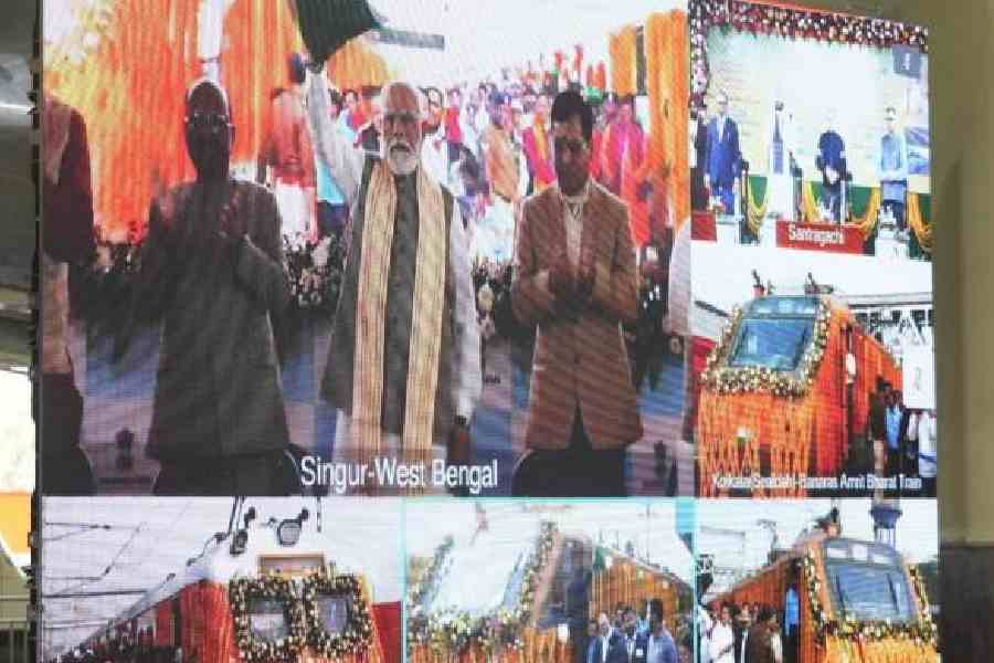A screen at Santragachhi station shows Modi virtually flagging off the trains from Singur