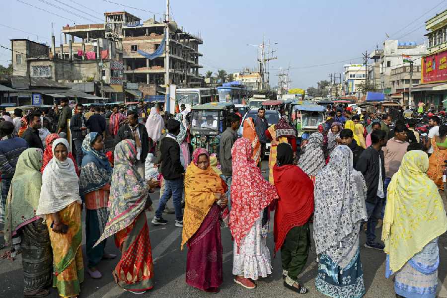 People in Malda block a stretch of National Highway 12 on Monday during a protest against the SIR.