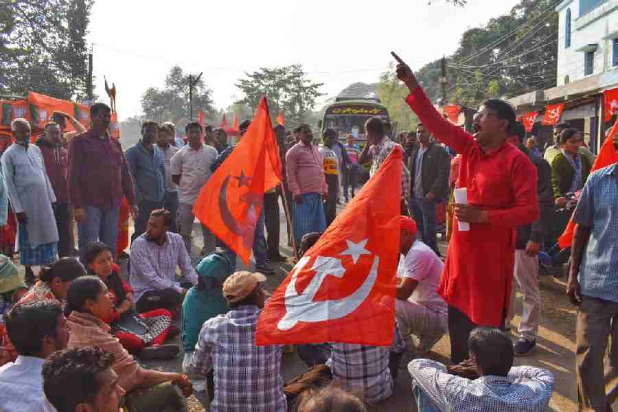 CPM supporters block a road in Nabadwip town, protesting against the harassment linked to the SIR.