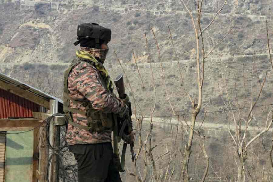 A soldier during a search operation in Kishtwar on Monday. 