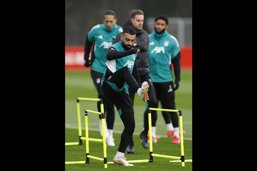 Liverpool's Mohamed Salah slogs it out during Tuesday's practice session at AXA Training Centre in Liverpool. 