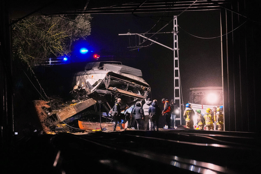 Emergency crews respond after a commuter train derailed when a retaining wall collapsed onto the tracks in Gelida, near Barcelona, Spain, Tuesday, Jan. 20, 2026.