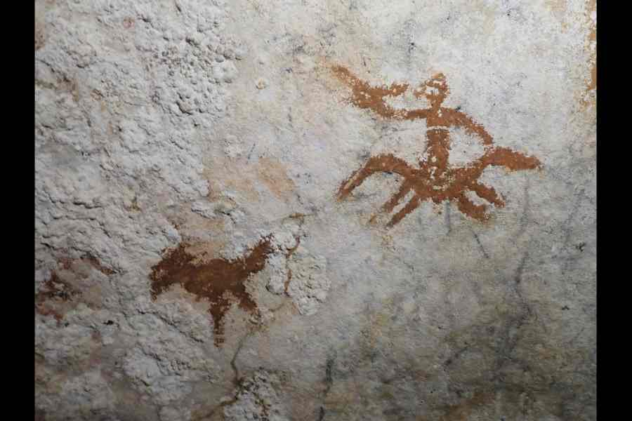 The hand stencil, dated to be at least 67,800 years old, at a cave on Sulawesi island.
