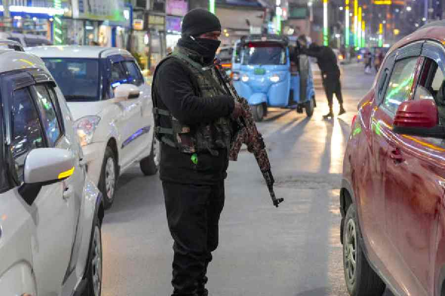 A jawan stands guard in Srinagar on Wednesday amid heightened security for Republic Day. 