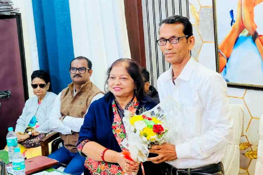 Amina Ahmed, the vice-chairperson, greets Dilip Saha, the new chairman, at the Cooch Behar municipality on Wednesday.