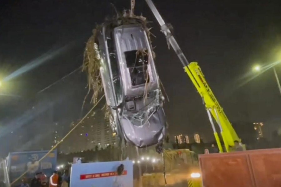 Car belonging to Yuvraj Mehta, a 27-year-old software engineer, who died after his car had plunged into a water-filled pit at a construction site, retrieved after a search operation, in Noida, Tuesday, Jan. 20, 2026.