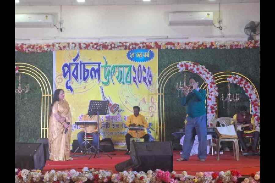 Resident Tapan Saha sings at Purbachal community hall.