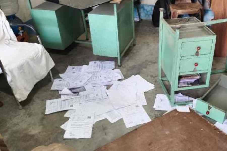 Broken furniture and documents lie scattered at the BDO's office at Farakka on January 14