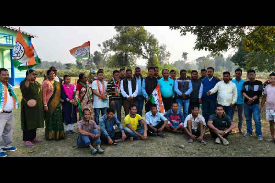 Leaders of the Trinamool Cha Bagan Sramik Union with workers on the Kalchini tea estate in Alipurduar on Wednesday