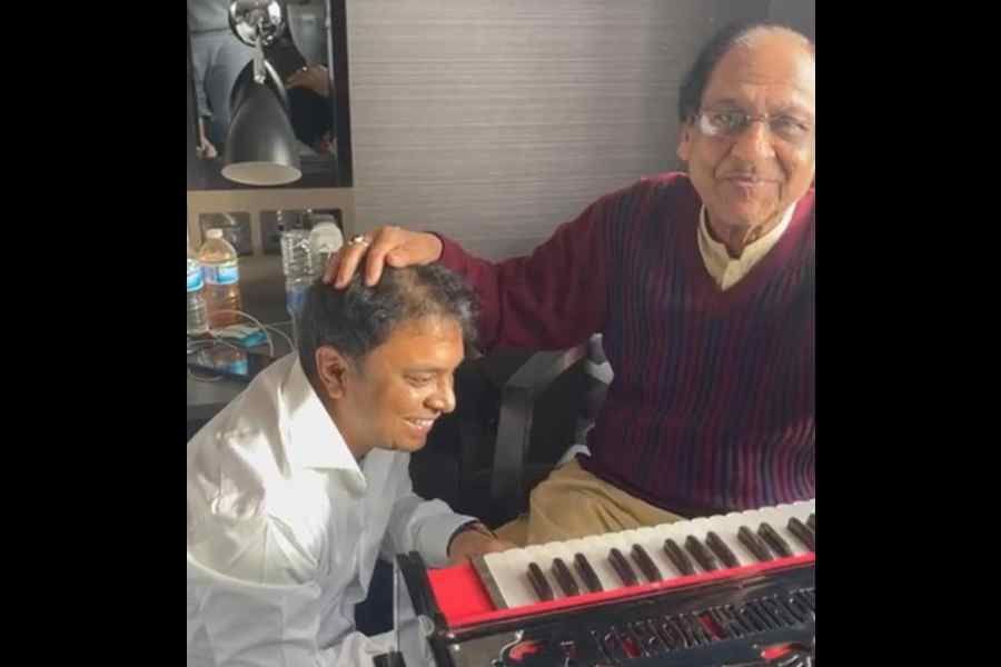 Rupak Poddar, owner of Harmonium World, with Ghulam Ali (right)