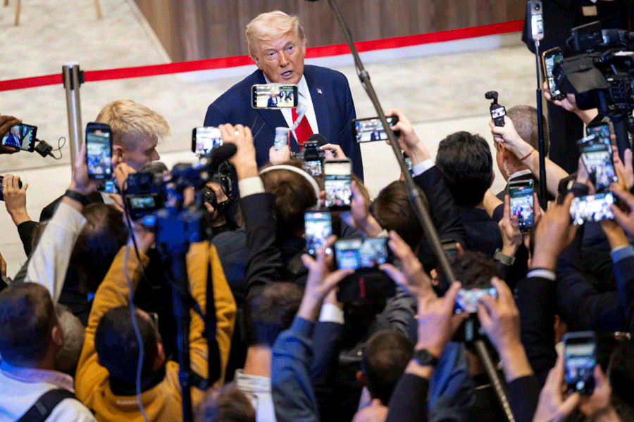 FILE PHOTO: U.S. President Donald Trump speaks with journalists after delivering his speech in a plenary session during the 56th annual meeting of the World Economic Forum, WEF, in Davos, Switzerland, Wednesday, January 21, 2026.