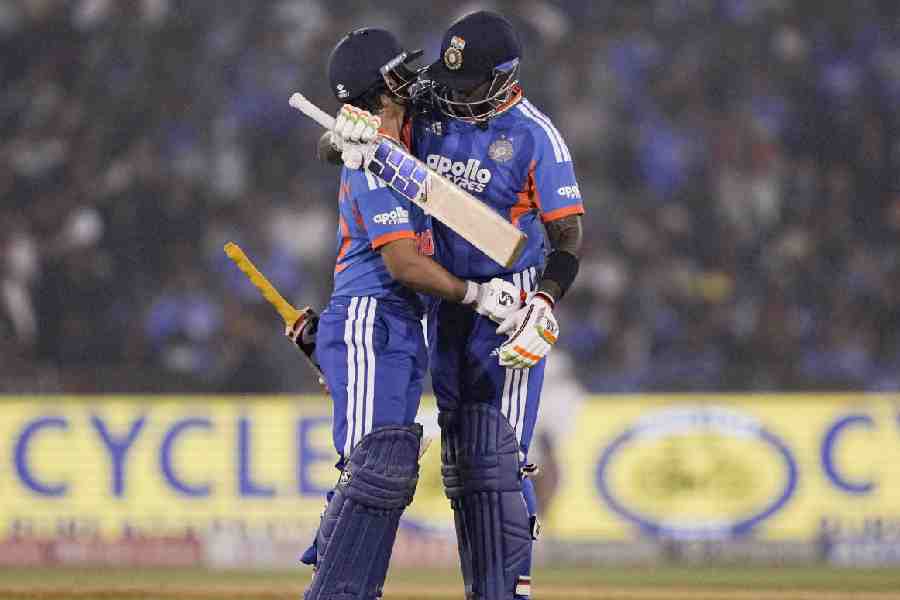India's captain Suryakumar Yadav hugs teammate Ishan Kishan after the latter's dismissal during the second T20I cricket match between India and New Zealand, at Shaheed Veer Narayan Singh International Cricket Stadium, in Raipur, Chhattisgarh