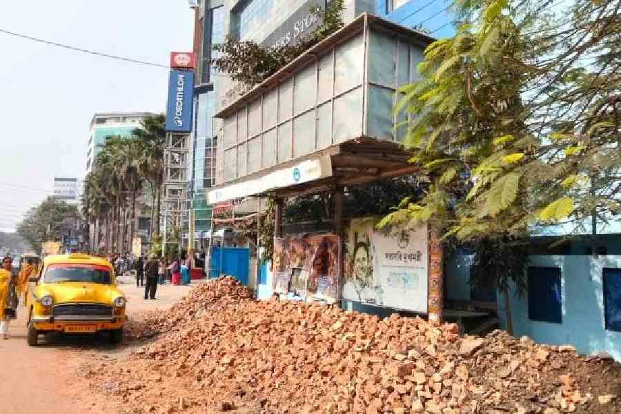 Crushed bricks block the bus stop in front of Acropolis Mall in Kasba on Friday