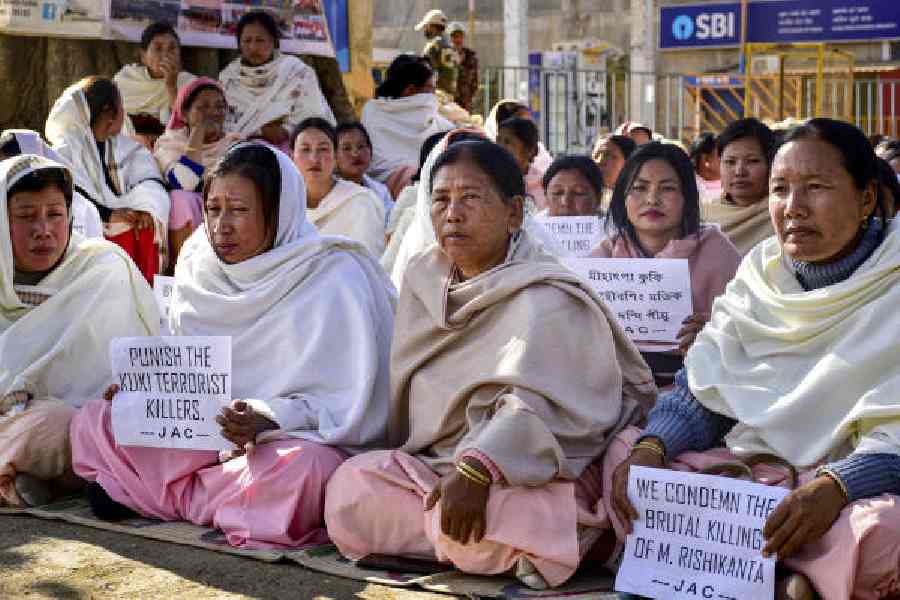 Locals and family members of Rishikanta stage a protest at Kakching Khunou Lamkhai, in Kakching, Manipur, on Thursday. 