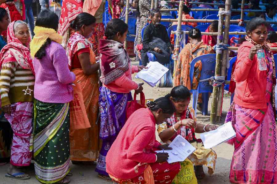 People queue up at a hearing centre in Balurghat on Tuesday. 