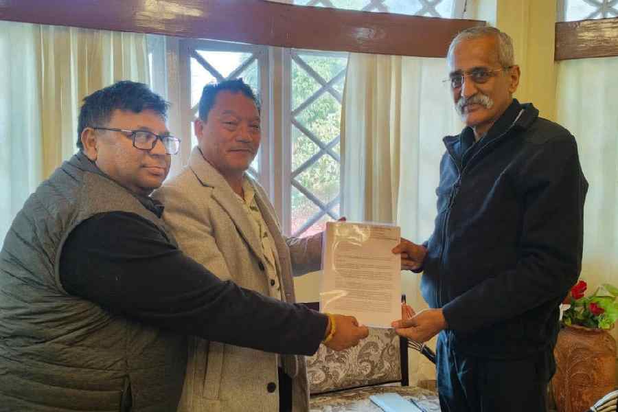 Bimal Gurung (centre) and Roshan Giri meet Pankaj Kumar Singh in Darjeeling on Saturday