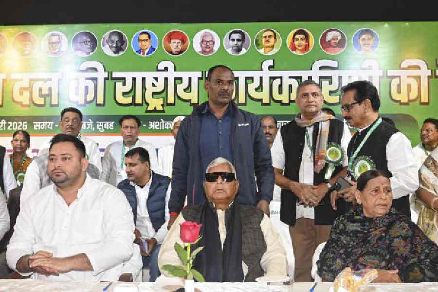 Tejashwi Yadav (left) with RJD chief Lalu Prasad at the party’s national executive committee meeting in Patna on Sunday. 