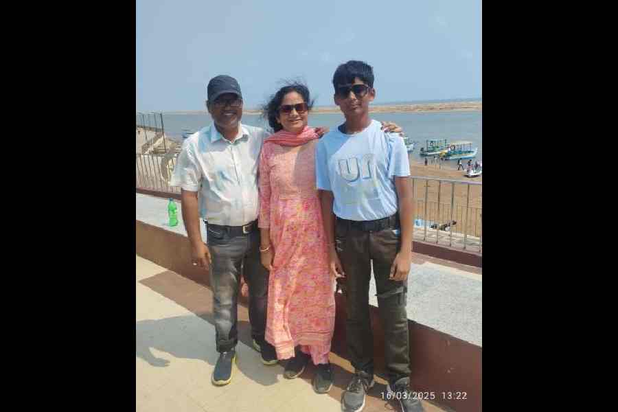 Pradeep Kumar Rout (left) with his wife Sipika Nayak and son