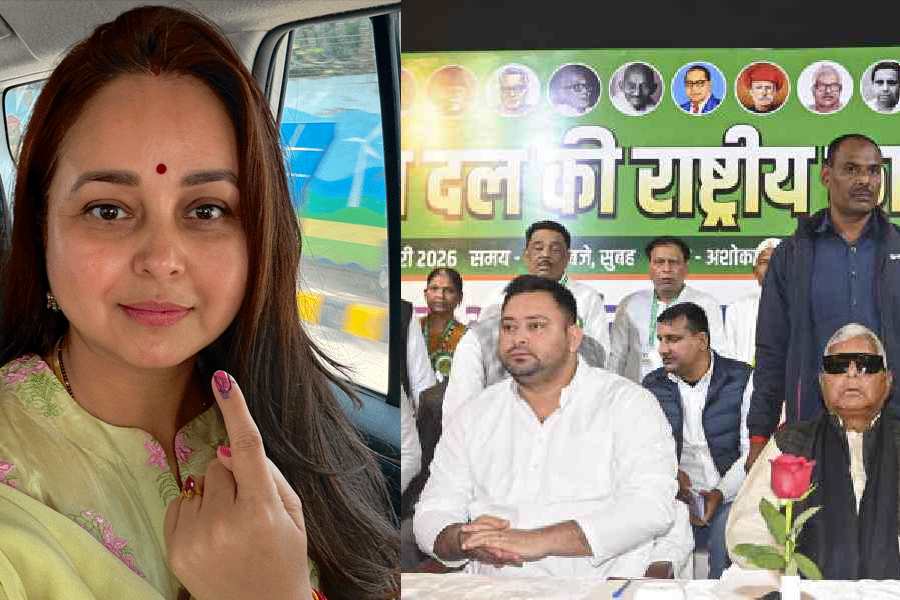 Tejashwi Yadav (left) with RJD chief Lalu Prasad at the party’s national executive committee meeting in Patna on Sunday. 