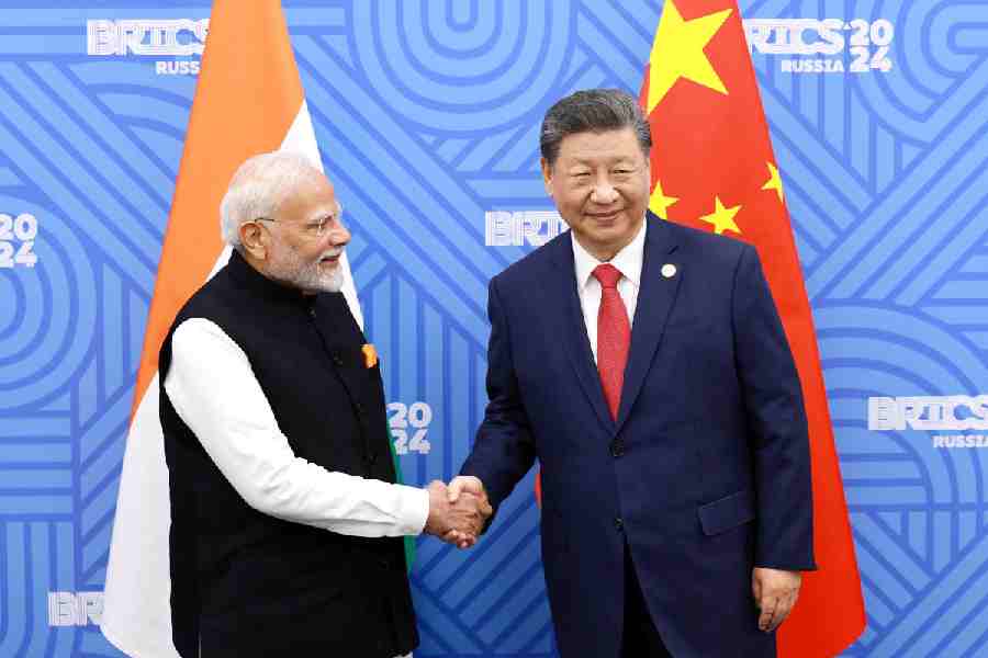 Chinese President Xi Jinping and India Prime Minister Narendra Modi meet on the sidelines of the BRICS summit in Kazan, Russia October 23, 2024.