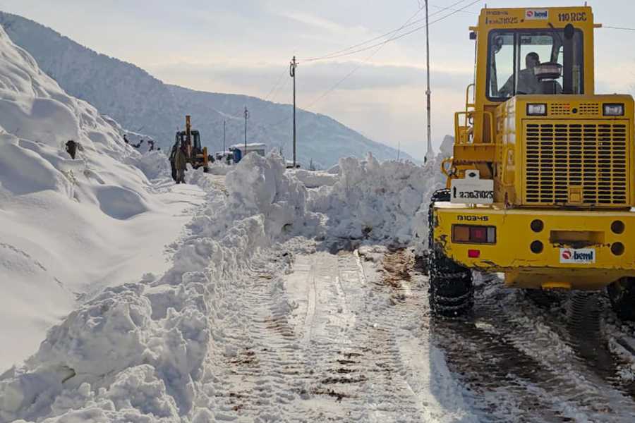 Border Roads Organisation personnel carry out snow clearance operations to restore roads affected by heavy snowfall, in Rajouri district of Jammu and Kashmir
