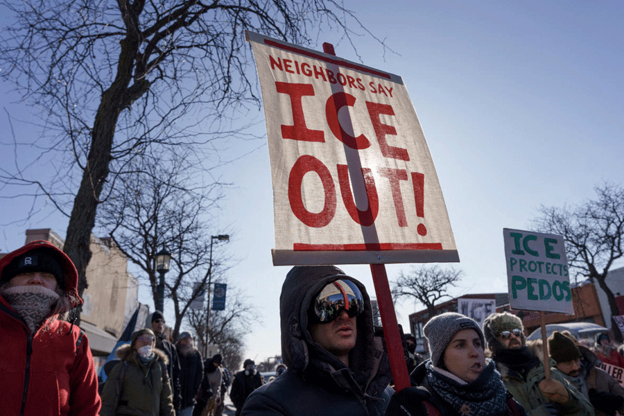 FILE PHOTO: Demonstrators carry signs condemning Immigration and Customs Enforcement (ICE) near the site where a man identified as Alex Pretti was fatally shot by federal agents trying to detain him, in Minneapolis, Minnesota, U.S., January 24, 2026.