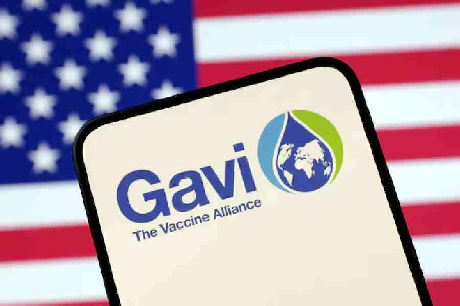 The Vaccine Alliance (GAVI) logo and US flag are seen in this illustration taken April 23, 2025.