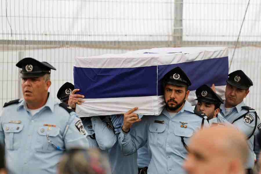 Police officers carry a coffin of Ran Gvili, an off-duty police officer who was killed fighting militants that had infiltrated Israel during the deadly October 7, 2023 attack by Hamas, and the last hostage recovered from Gaza, during his memorial service in Meitar, Israel, January 28, 2026.