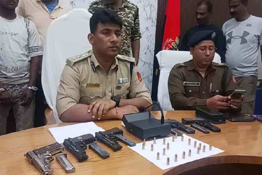 Avijit Banerjee, the Malda superintendent of police, shows the seized firearms and ammunition at his office on Wednesday.