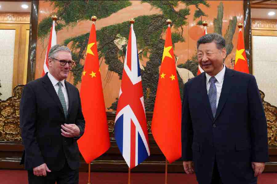 Britain's Prime Minister Keir Starmer greets Chinese President Xi Jinping ahead of a bilateral meeting during his visit to China, in Beijing, China, January 29, 2026.